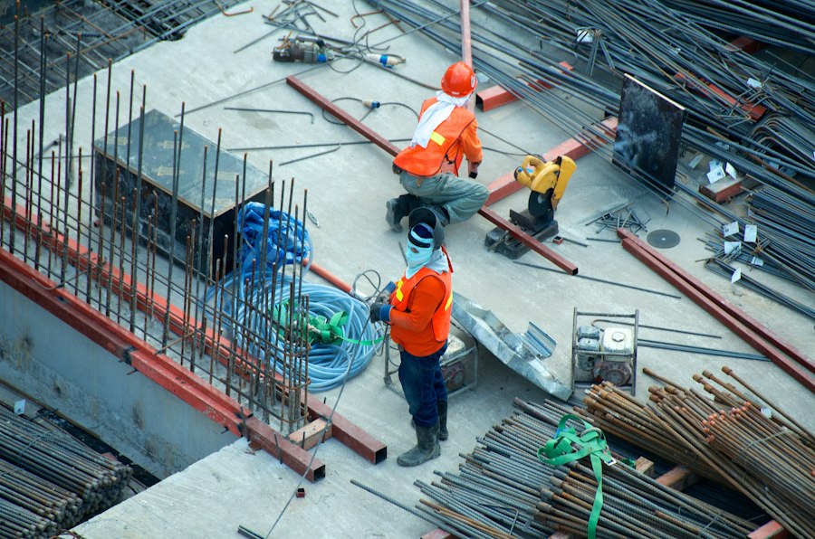 Luxury Builders Florida crew grading a job site before a concrete pour